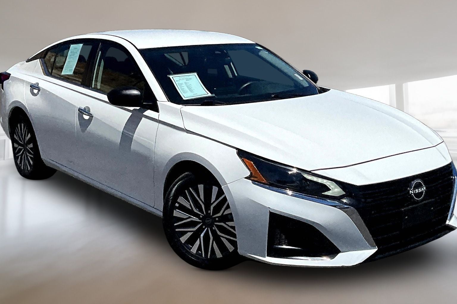 2025 Nissan Altima 2.5 SV in Glacier White — front three-quarter view