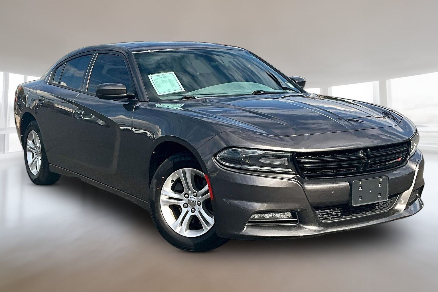 2019 Dodge Charger SXT in Granite — front three-quarter view