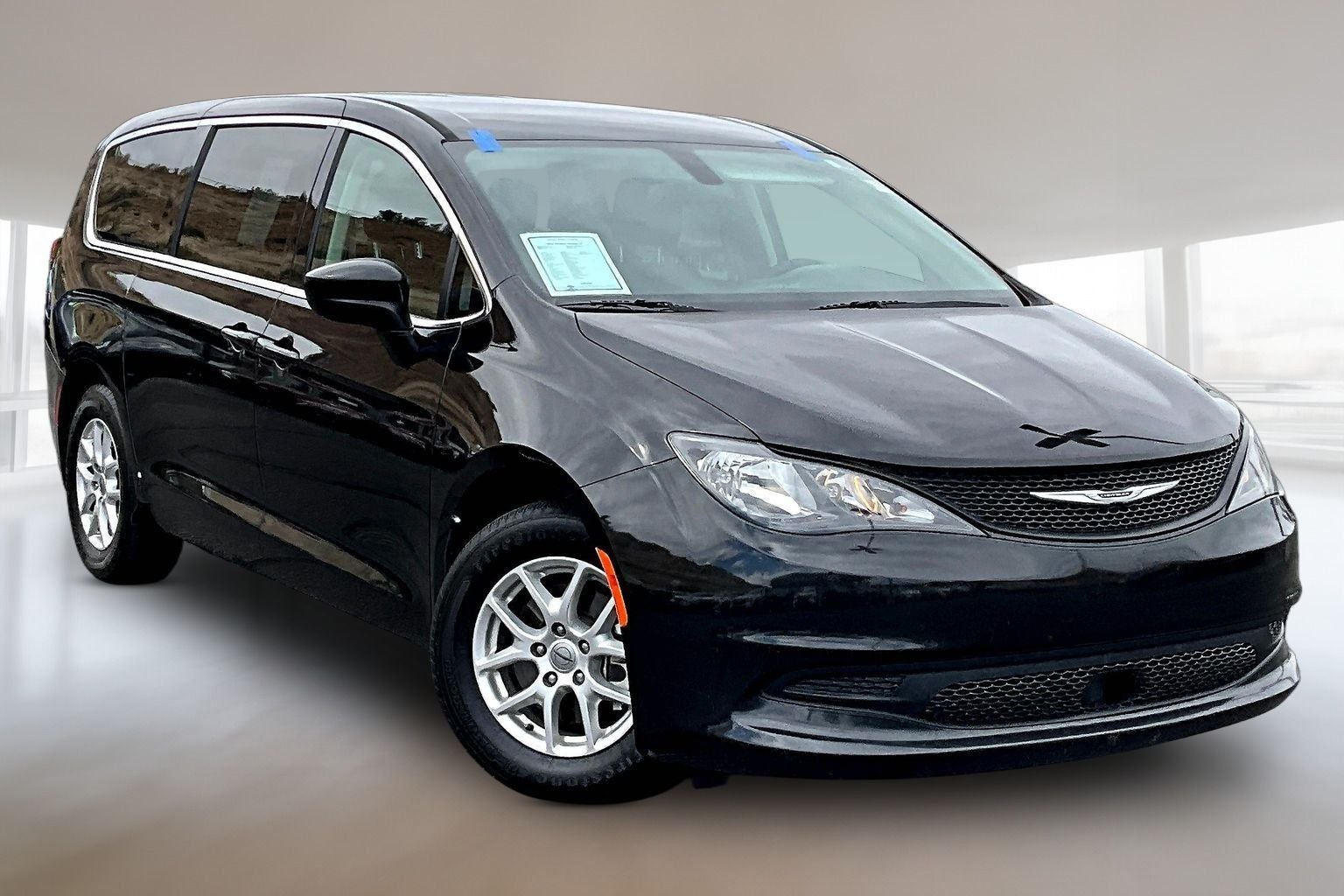 2022 Chrysler Voyager LX in Brilliant Black Crystal Pearlcoat — front three-quarter view