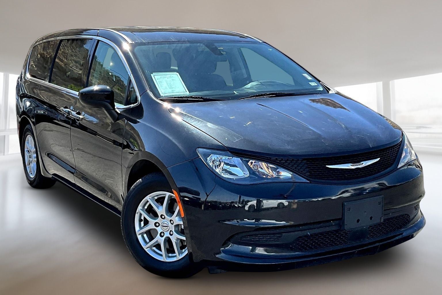 2022 Chrysler Voyager LX in Brilliant Black Crystal Pearlcoat — front three-quarter view