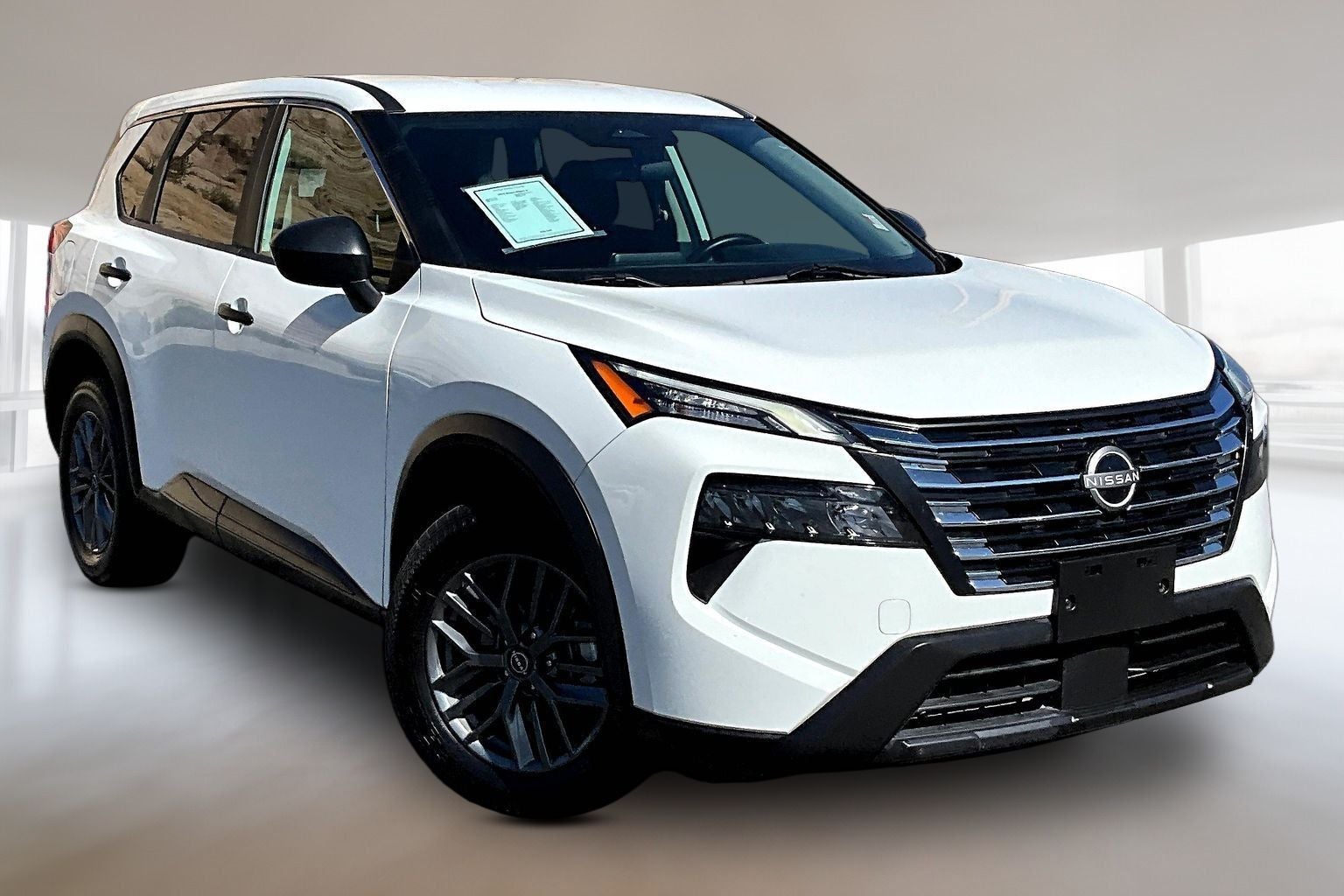 2024 Nissan Rogue S in Glacier White — front three-quarter view