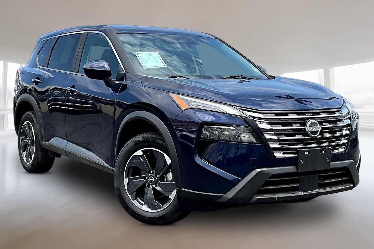 2025 Nissan Rogue SV in Deep Ocean Blue — front three-quarter view
