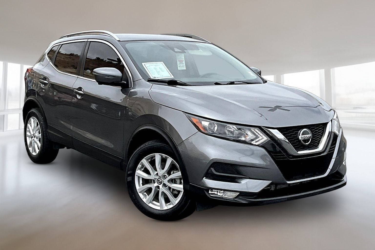 2022 Nissan Rogue Sport SV in Gun Metallic — front three-quarter view