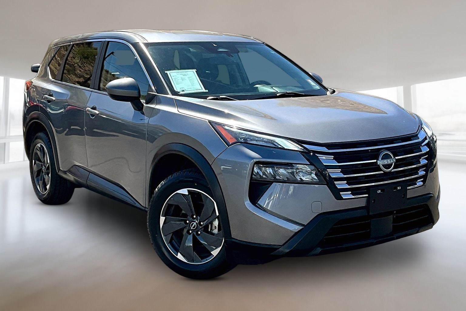 2024 Nissan Rogue SV in Gun Metallic — front three-quarter view