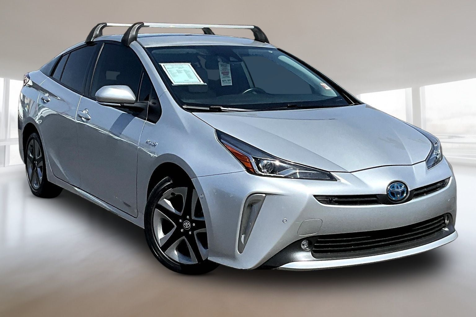 2022 Toyota Prius XLE in Classic Silver Metallic — front three-quarter view